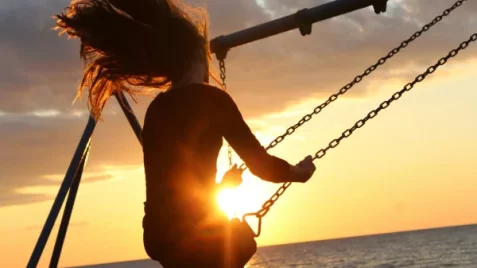 Person on a swing - Hypnotherapy in Kingston